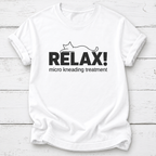 A white short-sleeve crewneck t-shirt with a black graphic print on the front. The graphic features the word 'RELAX!' in bold capital letters with a minimalist line drawing of a cat above it, and the phrase 'micro kneading treatment' printed below in a smaller font.
