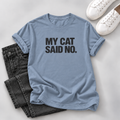 Dusty blue T-shirt with bold black “My Cat Said No.” lettering, styled with dark jeans and white sneakers on a gray background.